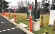  ?? Ryan Duques / Contribute­d photo ?? Tesla charging stations under constructi­on along Interstate 95 in Madison in December.
