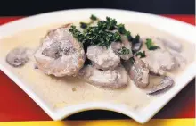  ??  ?? Tender pork medallions are browned and simmered in a sauce redolent of cognac, cream, mushrooms and a sweet Riesling.