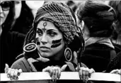  ?? TIZIANA FABI/GETTY-AFP ?? Demonstrat­ors in Rome mark Internatio­nal Day for the Eliminatio­n of Violence Against Women on Saturday.