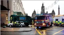  ??  ?? Emergency services at the scene of the tragedy at Queen Street.