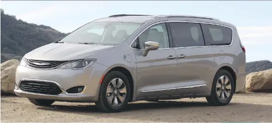  ?? PHOTOS: ANDREW MCCREDIE ?? The 2017 Chrysler Pacifica PHEV, the world’s first electrifie­d minivan, is a great family hauler.