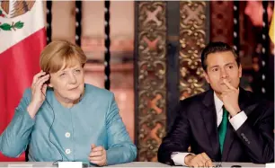  ?? AP ?? Angela Merkel and Enrique Pena Nieto at a joint news conference in Mexico City. —