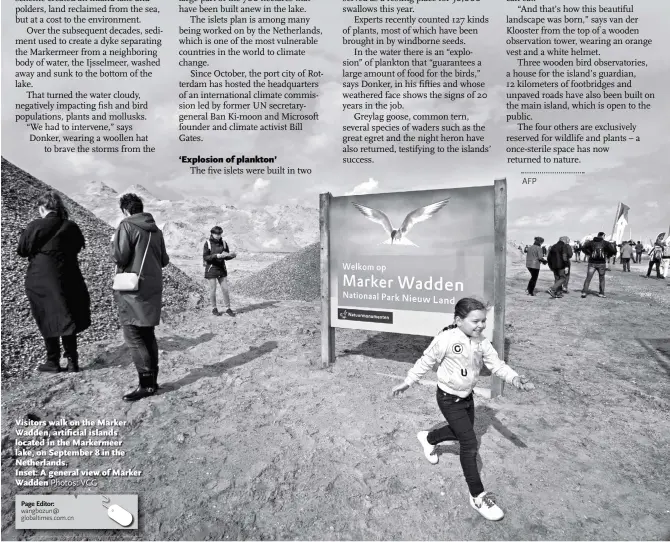  ?? Photos: VCG ?? Visitors walk on the Marker Wadden, artificial islands located in the Markermeer lake, on September 8 in the Netherland­s.Inset: A general view of Marker Wadden