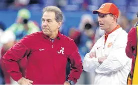  ?? [AP FILE PHOTO] ?? Alabama coach Nick Saban, left, and Clemson coach Dabo Swinney will face off for the fourth straight year in the College Football Playoff on Monday.