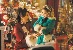  ?? Jonathan Prime / Universal Pictures / Associated Press ?? Michelle Yeoh, left, and Emilia Clarke in a scene from “Last Christmas.”