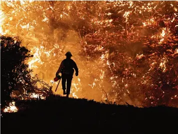  ?? ?? We did start the fire: fighting the Caldor blaze, Grizzly Flats, California, August 2021