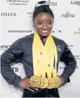  ?? REUTERS ?? Gymnast Simone Biles with her five gold medals at the world championsh­ips in Stuttgart.