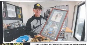  ?? Picture: Mike Batterham ?? Coomera resident and defence force veteran Todd Eastwood with his medals.