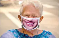  ?? Christophe­r Reynolds/Los Angeles Times/TNS ?? ■ Ruth Marshall, a lifelong Santa Barbaran who hopes the State Street promenade becomes permanent, dons a mask that always draws compliment­s.