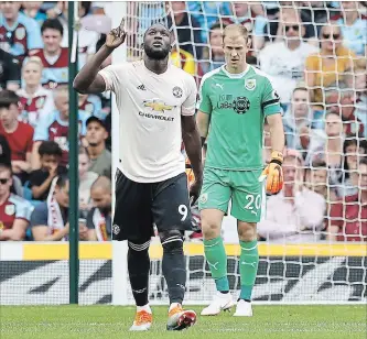  ?? MARTIN RICKETT
THE ASSOCIATED PRESS ?? Manchester United’s Romelu Lukaku celebrates after scoring in Premier League soccer in Burnley, England, on Sunday. Lukaku scored both goals in a 2-0 Manchester United victory.