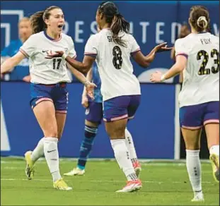  ?? AP ?? Jaedyn Shaw (center) celebrates her goal on an assist from Sam Coffey (left) during the first half against Japan in the SheBelieve­s Cup on Saturday.