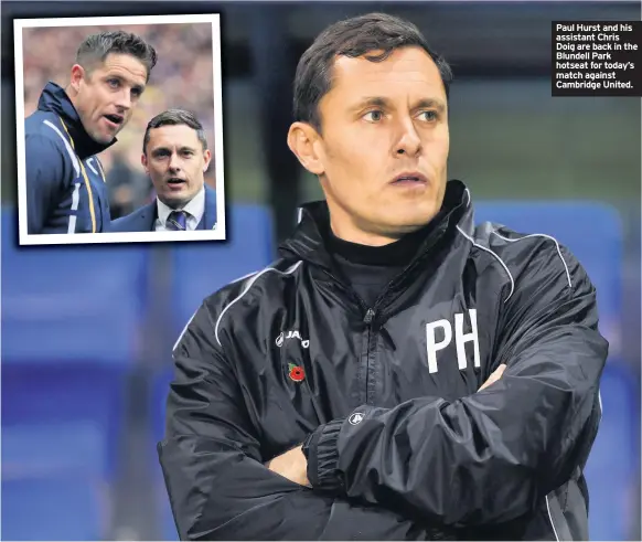  ??  ?? Paul Hurst and his assistant Chris Doig are back in the Blundell Park hotseat for today’s match against Cambridge United.