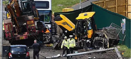  ?? ?? Devastatio­n: Investigat­ors at the scene of the accident on the outskirts of Glasgow, in May 2016