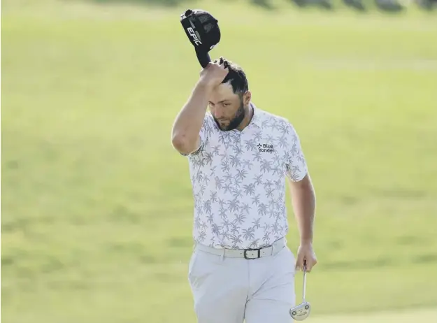  ??  ?? 0 Spain’s Jon Rahm reacts as he walks off the 18th green after completing his third round of The Memorial Tournament at Muirfield Village Golf Club in Ohio