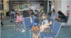  ??  ?? Children take advantage of the Vunilagi Book Club first public reading at Albert Park July 21, 2018.