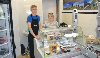  ?? 50_c24kintyre­larder01_linda and cameron ?? Linda McLean with her summer assistant, Cameron Macalister, at the deli counter.