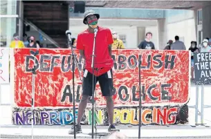  ?? ANDREW FRANCIS WALLACE TORONTO STAR ?? Activist Desmond Cole speaks at a rally at Nathan Phillips Square on Sunday. “We never counted on the justice system to deliver fairness and accountabi­lity, did we?” Cole asked the crowd.