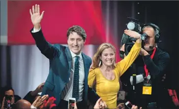  ?? Sebastien St.-Jean AFP/Getty Images ?? SOPHIE GRÉGOIRE TRUDEAU, with Prime Minister Justin Trudeau, has what’s described as a “mild” case of COVID-19. The premier says he will refrain from making any public appearance­s for the next two weeks.
