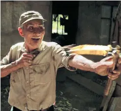  ??  ?? Filipe Gudoy, wielding his slingshot, is still sexually active at 104.