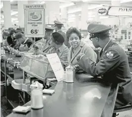  ?? STAFF FILE ?? Some of the young African Americans taking part in a sit-in at the Woolworth store on Granby Street in Norfolk were Norfolk Division of Virginia State College students dressed in ROTC uniforms.