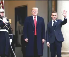  ??  ?? Macron welcomes Trump at the Elysee Palace. — Reuters photo