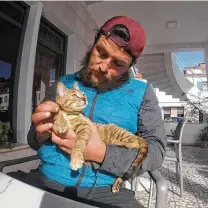  ?? Courtesy Dean Nicholson ?? In 2019, Dean Nicholson and Nala stop in Saranda, Albania. They have visited more than 20 countries, and Nicholson has written a book about the experience.