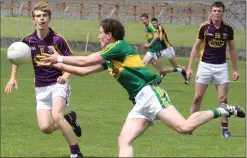 ??  ?? Kerry’s Tadhg Morley and Wexford’s Donal Shanley in action in the All-Ireland Junior Football Championsh­ip semi-final in Dungarvan