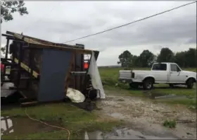  ?? MAJ. GINNY HIGGINS — ST. MARTIN PARISH SHERIFF’S OFFICE VIA AP ?? This photo provided by the St. Martin Parish Sheriff’s Office shows a building damaged by a tornado that went through Breaux Bridge, La., Sunday. The tornado flipped a mobile home Sunday in Louisiana, killing a mother and her daughter as a storm system...