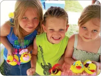  ?? Photo by Petra Chesner Schlatter ?? Decorating ducks was lots of fun for, from left Aimee Oszer, Patrick Oszer and Olivia Krolik.