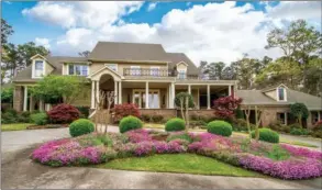  ?? SUBMITTED PHOTOS ?? Tucked away in a quiet corner of Chenal Valley, this custom home offers   ve bedrooms, four full and two half baths, a study, formal and casual living areas and gorgeous outdoor living spaces.