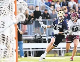  ?? TERRANCE WILLIAMS/CAPITAL GAZETTE ?? Severna Park’s Joaquin Villagomez handles the ball against Broadneck’s Nate Levicki during the first half of the Anne Arundel County lacrosse championsh­ip game on Monday in Annapolis.