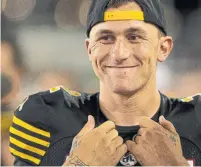 ?? PETER POWER/THE CANADIAN PRESS ?? After seeing duty in the pre-season, Johnny Manziel spent his first five regular-season games with the Ticats on the sidelines.