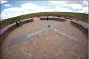  ?? DAVID ZALUBOWSKI — THE ASSOCIATED PRESS ?? People visit the Columbine Memorial Wednesday in Littleton, Colo. Trauma still shadows the survivors of the Columbine High School shooting as it's 25th anniversar­y approaches.