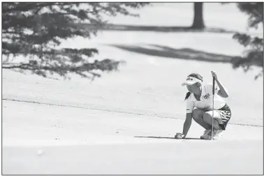  ?? NWA Democrat-Gazette/J.T. WAMPLER ?? Mackenzie Lee of North Little Rock lines up a putt Wednesday at the Fayettevil­le Country Club during the final round of 6A girls state golf tournament.