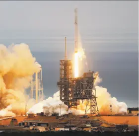 ?? Red Huber / Orlando Sentinel ?? The SpaceX Falcon rocket lifts off last month from the Apollo moon mission launchpad with cargo destined for the Internatio­nal Space Station.