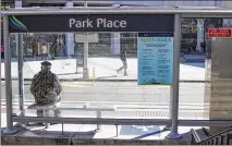  ?? REANN HUBER PHOTOS / REANN.HUBER@AJC.COM ?? A man waits at the Park Place stop for the Atlanta Streetcar on Friday.