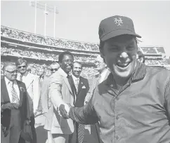  ?? AP FILE PHOTO ?? Hank Aaron shakes hands with Mets pitcher Tom Seaver on Oct. 13, 1973.