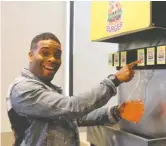  ?? NATHANIEL WOOD ?? At the Good Burger pop-up restaurant, Kel Mitchell confirms that he still loves the orange soda.