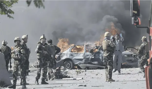  ?? PICTURE: GETTY IMAGES ?? 0 Afghan security forces personnel at the site of a car bomb attack which was one of the worst attacks Kabul has seen since 2014