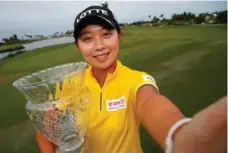  ?? KEVIN C. COX/GETTY IMAGES ?? Hyo Joo Kim is all smiles after winning the LPGA’s season opener Sunday.