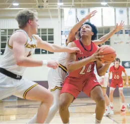  ?? TROY STOLT/DAILY SOUTHTOWN ?? Marist’s Achilles Anderson (24) pump fakes a defender against Joliet Catholic Academy on Thursday.