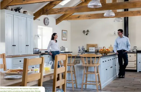  ??  ?? Once a milking parlour, the kitchen has modern pendant lights emulating the original dairy fittings