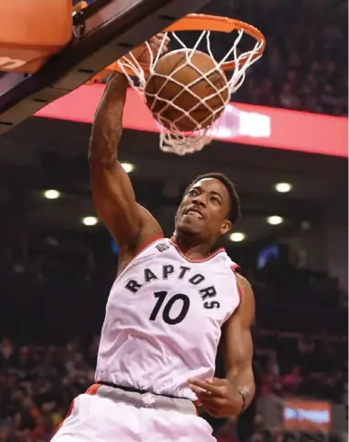  ?? DAN HAMILTON/USA TODAY SPORTS ?? WITH AUTHORITY Raptors guard DeMar DeRozan slams home a dunk against the Brooklyn Nets Tuesday night at the ACC. DeRozan had 25 points in the Raptors’ 104-99 victory.