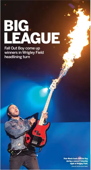  ?? ASHLEE REZIN/SUN-TIMES ?? Pete Wentz leads Fall Out Boy during a concert Saturdayni­ght at Wrigley Field.