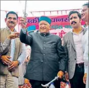  ??  ?? CM Virbhada Singh waving a sword after filing his nomination papers from Arki in Solan district on Friday. DEEPAK SANSTA/ HT