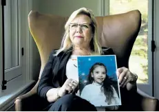  ?? NATHAN DENETTE/THE CANADIAN PRESS ?? Jeannette VanderMare­l, co-founder of cannabis company The Green Organic Dutchman Holding inc., holds a photo of her late daughter Breanne at her home in Ancaster, Ont., on June 1. Breanne died from Dravet Syndrome, which inspired her to help start the...