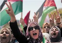  ?? KHALIL HAMRA THE ASSOCIATED PRESS ?? Several thousand Palestinia­ns marched in Gaza City for a “day of rage” on Wednesday to protest Israel’s annexation plans.
