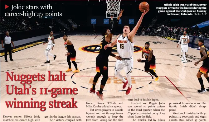  ?? Photo: AFP ?? Nikola Jokic ( No. 15) of the Denver Nuggets drives to the basket during the game against the Utah Jazz on Sunday in Denver, Colorado.