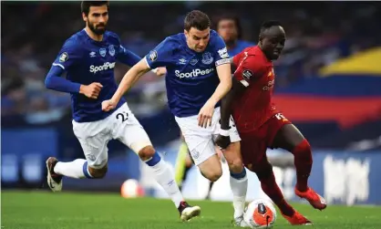  ??  ?? Sadio Mané is muscled off the ball by Everton’s Seamus Coleman on a night when Liverpool’s forward line failed to fire without Mohamed Salah. Photograph: Peter Powell/PA Wire/NMC Pool/PA