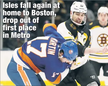  ?? Getty Images ?? GOLIATH WINS: The Islanders Matt Martin is no match for towering Zdeno Chara, but fought the 6-foot-9 Bruin anyway in the second period of Tuesday’s 5-0 loss at the Coliseum.